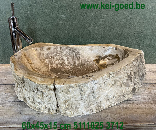 Beige bathroom sink made of petrified wood